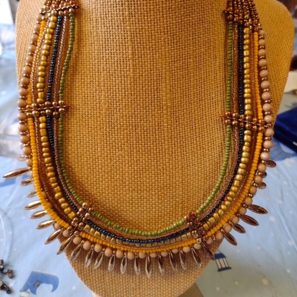 Boho multi strand beaded necklace with gold tone accents